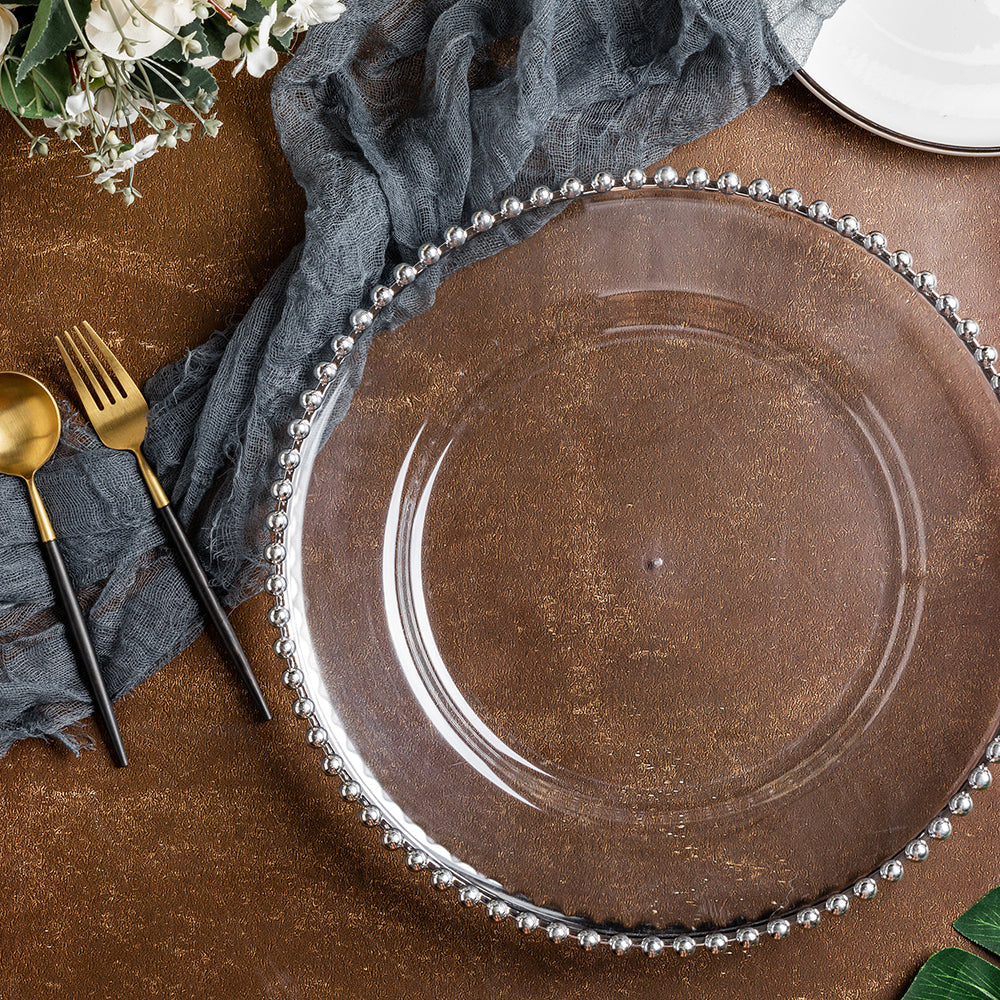 https://cdn.shopify.com/s/files/1/0042/0390/5136/products/Acrylic-Beaded-Round-Charger-Plate-13-Inch-Silver-Trim-Env.jpg?v=1744805592