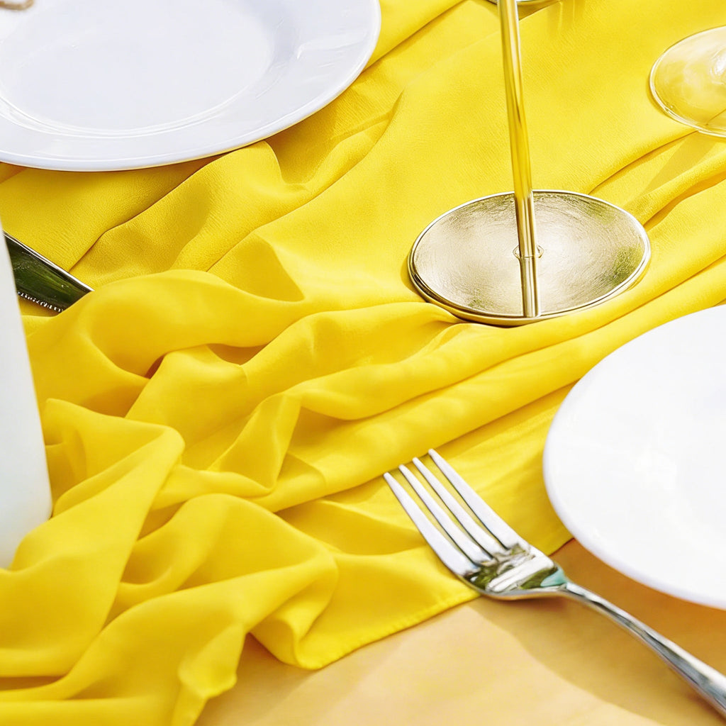 https://cdn.shopify.com/s/files/1/0042/0390/5136/files/Chiffon-Wedding-Table-Runner-10x27-Canary-Yellow-lifestyle-CU.jpg?v=1771040169