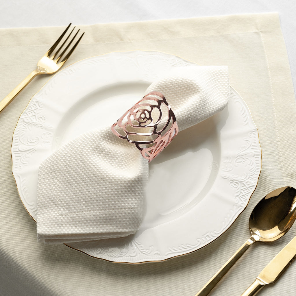 https://cdn.shopify.com/s/files/1/0042/0390/5136/files/Laser-Cut-Rose-Metal-Napkin-Ring-Rose-Gold-environmental-2_1.jpg?v=1767714982
