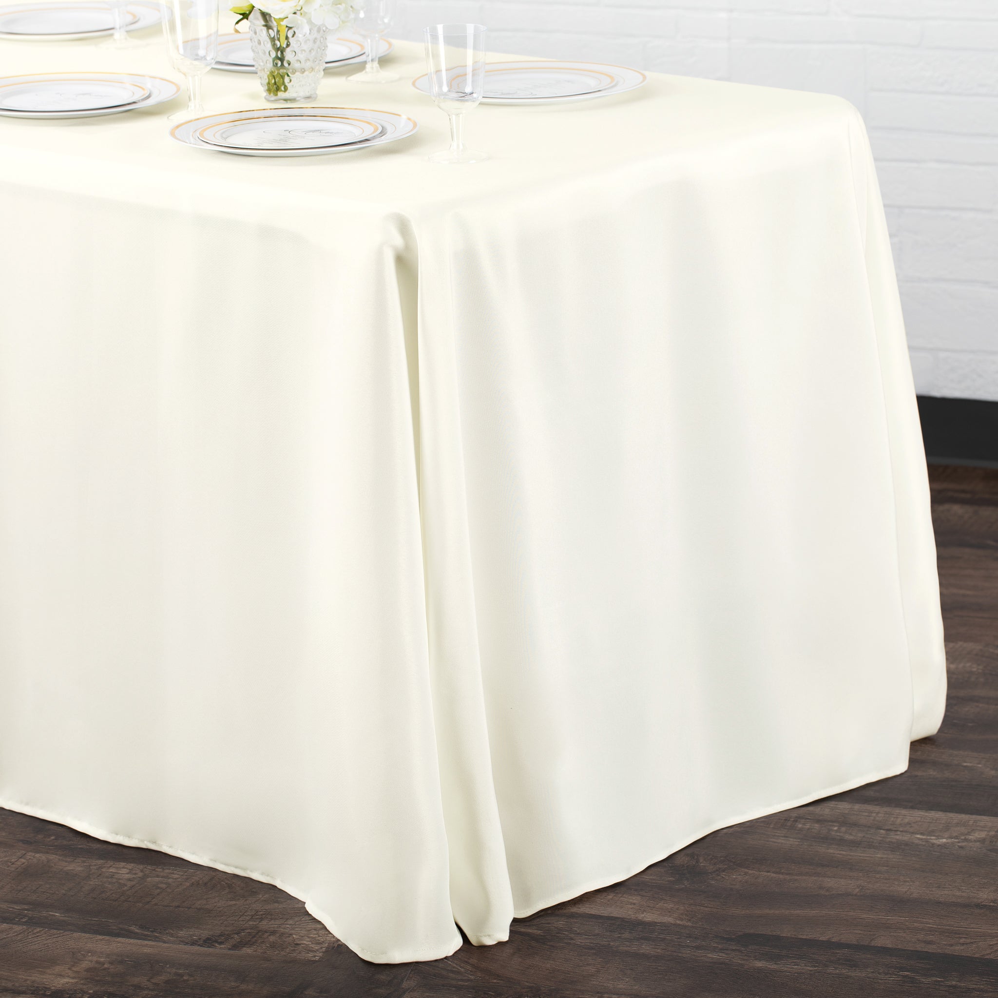 https://cdn.shopify.com/s/files/1/0042/0390/5136/products/Polyester-Rectangular-Tablecloth-Light-Ivory-Off-White-Env.jpg?v=1773895630
