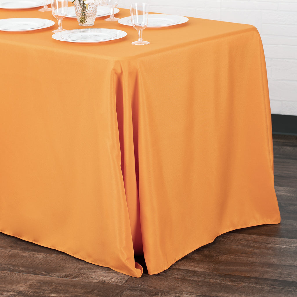 https://cdn.shopify.com/s/files/1/0042/0390/5136/products/Polyester-Rectangular-Tablecloth-Orange-Env.jpg?v=1744750984