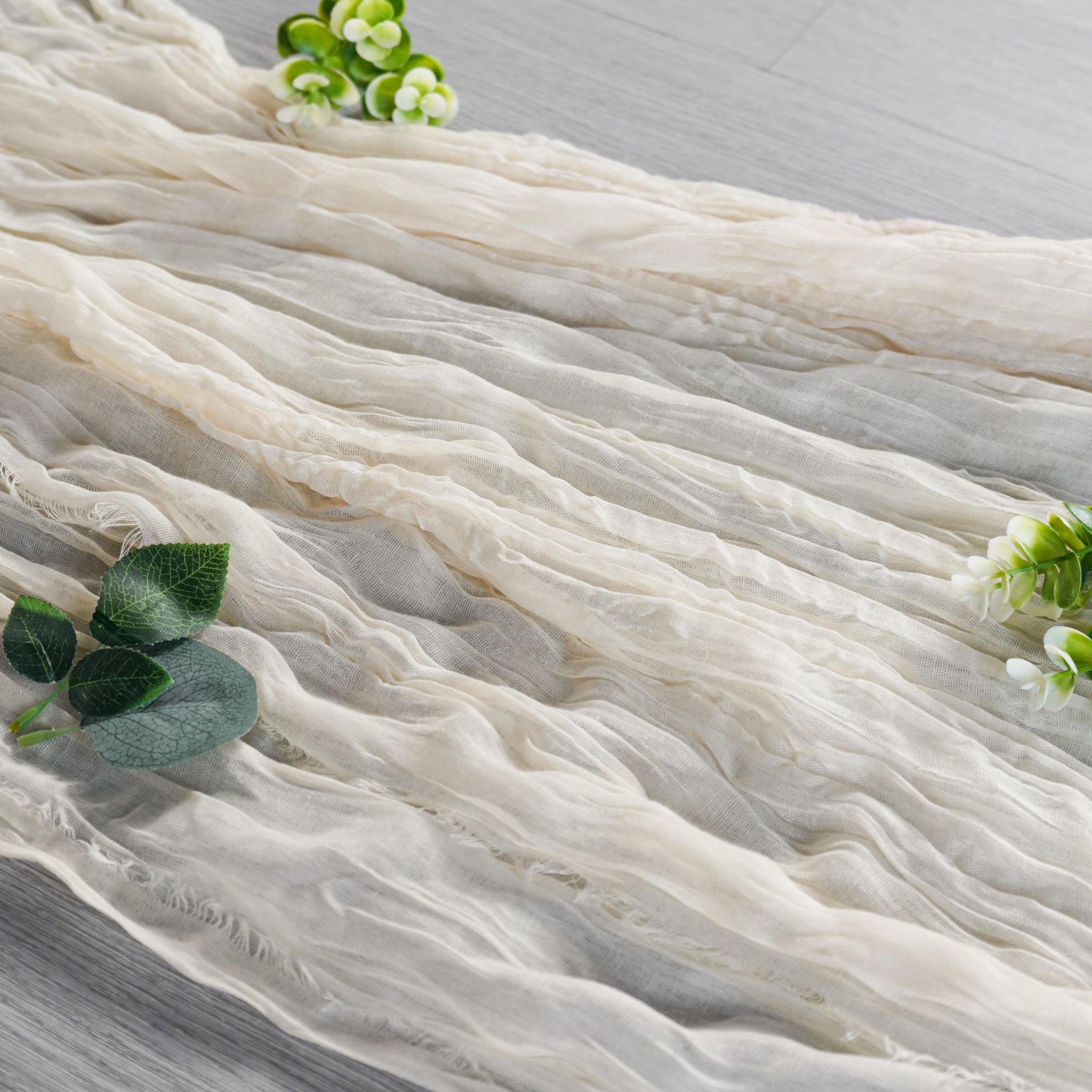 https://cdn.shopify.com/s/files/1/0042/0390/5136/products/PremiumCheeseclothTableRunner16FTx25_-Ivory.jpg?v=1744688497