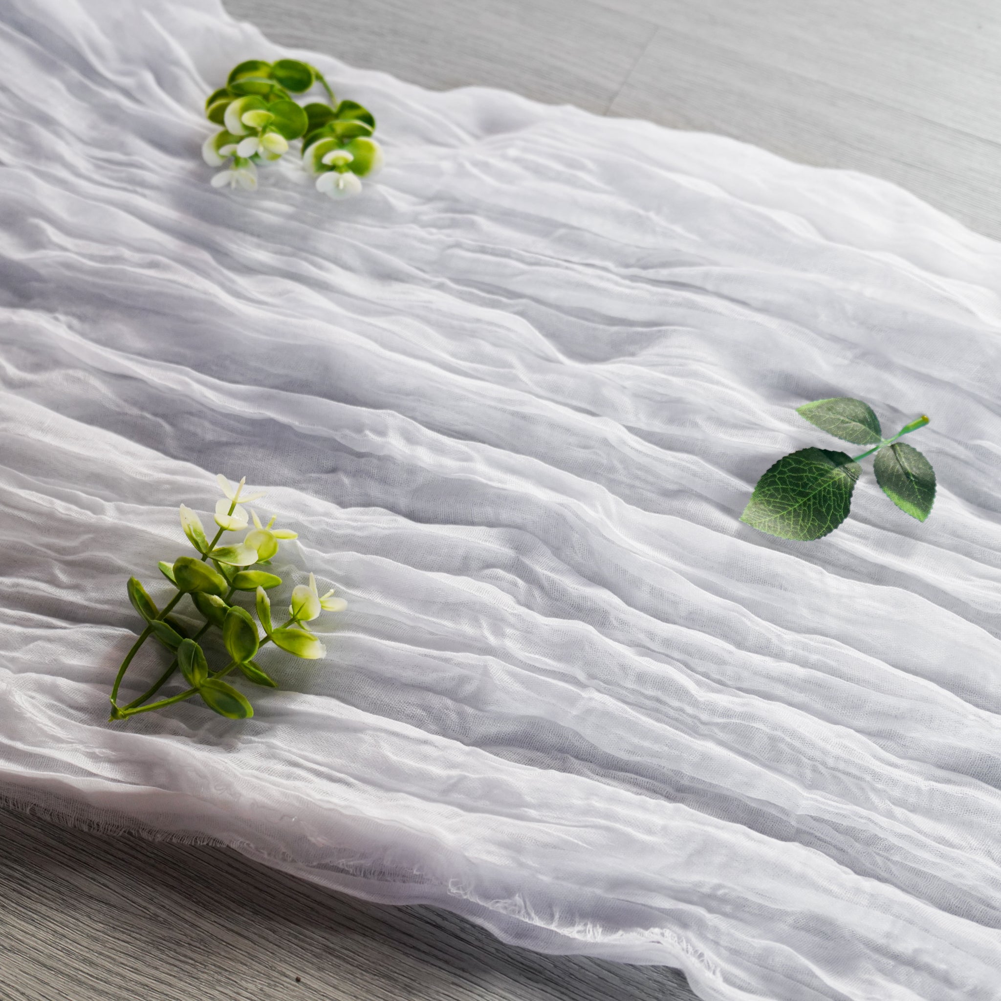 https://cdn.shopify.com/s/files/1/0042/0390/5136/products/PremiumCheeseclothTableRunner16FTx25_-White3.jpg?v=1775077938