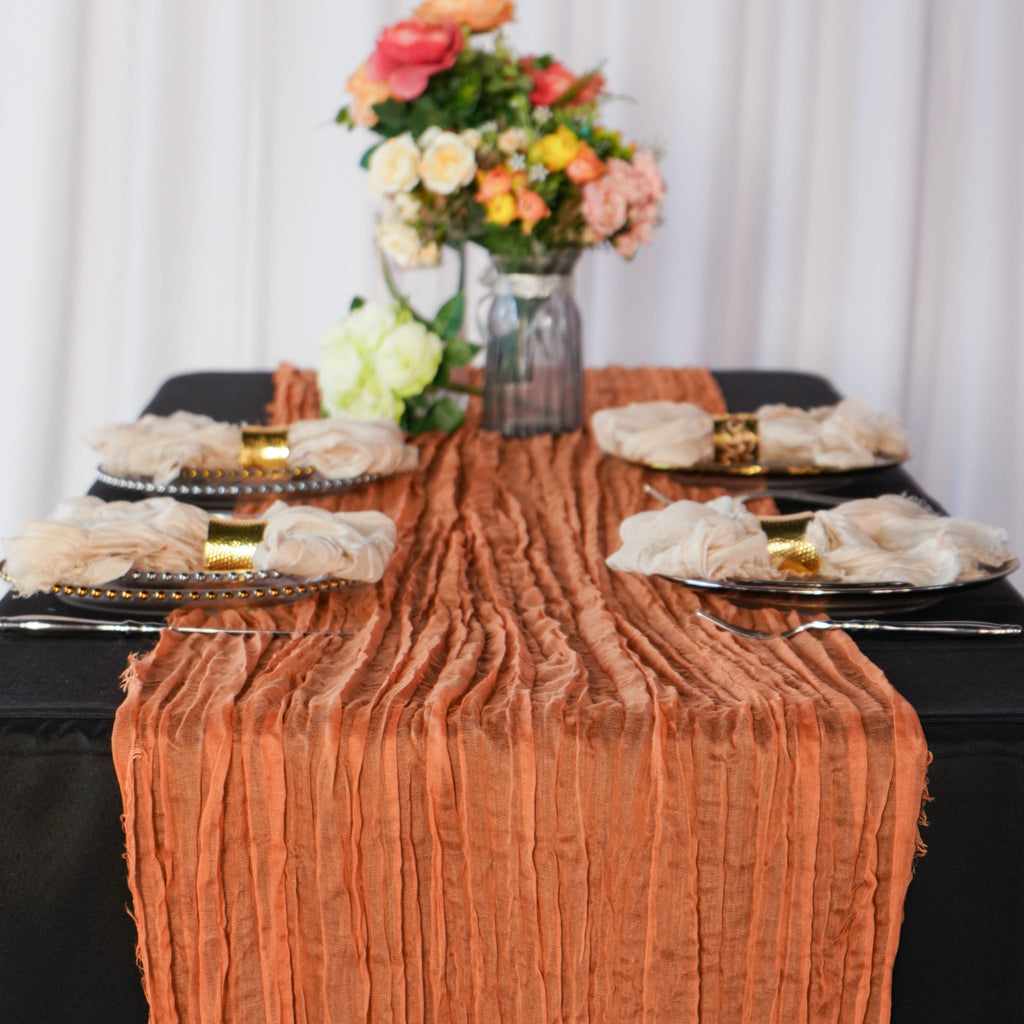 https://cdn.shopify.com/s/files/1/0042/0390/5136/products/PremiumCheeseclothTableRunner16FTx25_Terracotta.jpg?v=1668458402