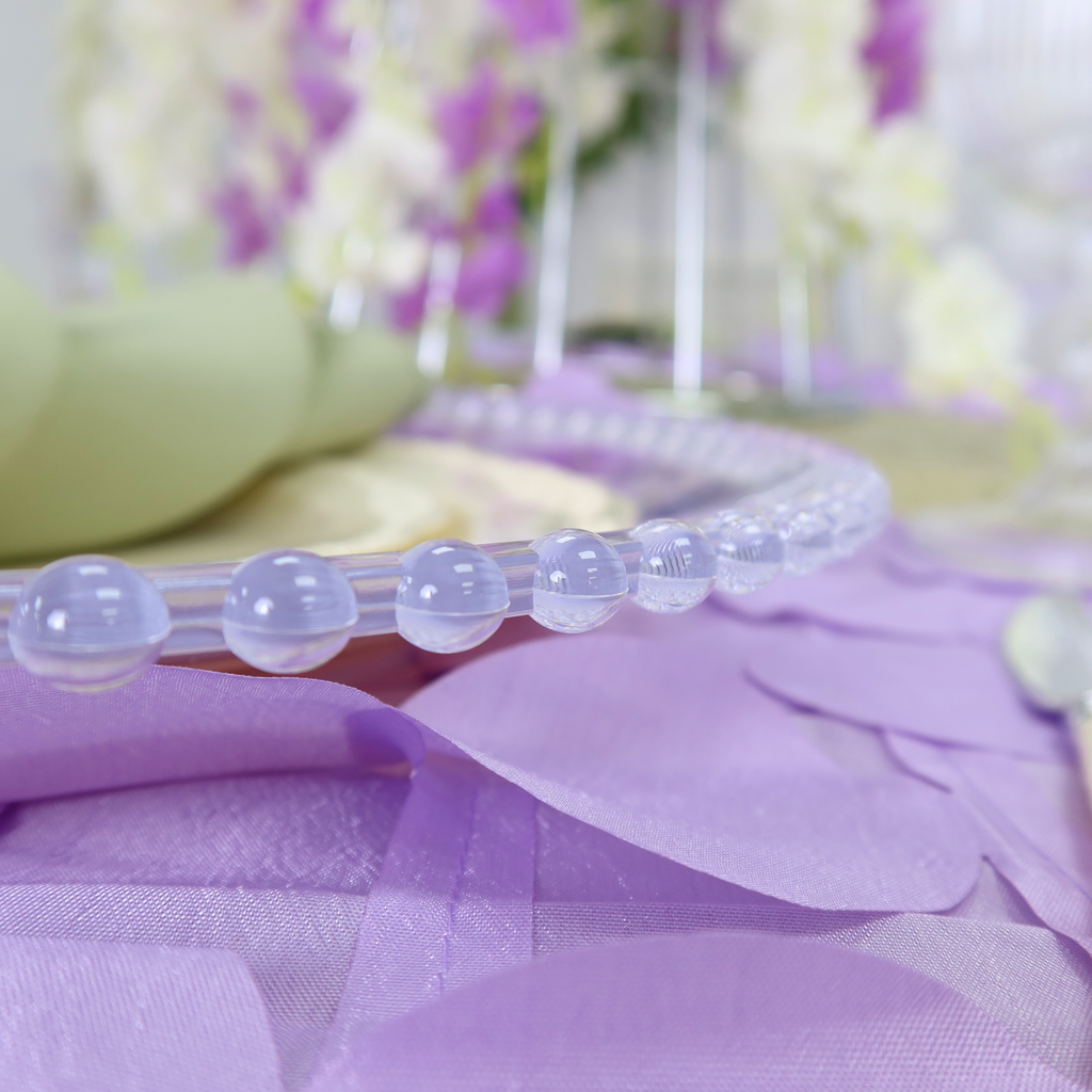 https://cdn.shopify.com/s/files/1/0042/0390/5136/files/acrylic-beaded-round-charger-plate-clear1.png?v=1744805389