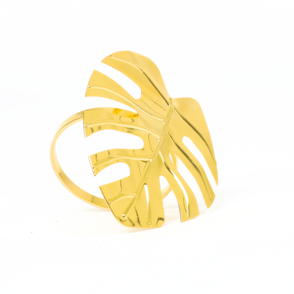 https://cdn.shopify.com/s/files/1/0042/0390/5136/files/gold-monstera-leaf-napkin-ring2.png?v=1712853347