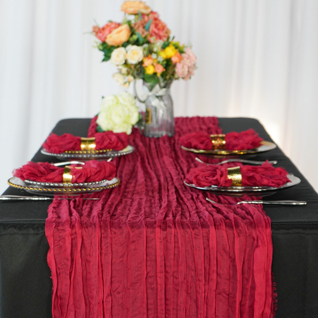 https://cdn.shopify.com/s/files/1/0042/0390/5136/products/premium-cheesecloth-table-runner-burgundy.jpg?v=1668459734