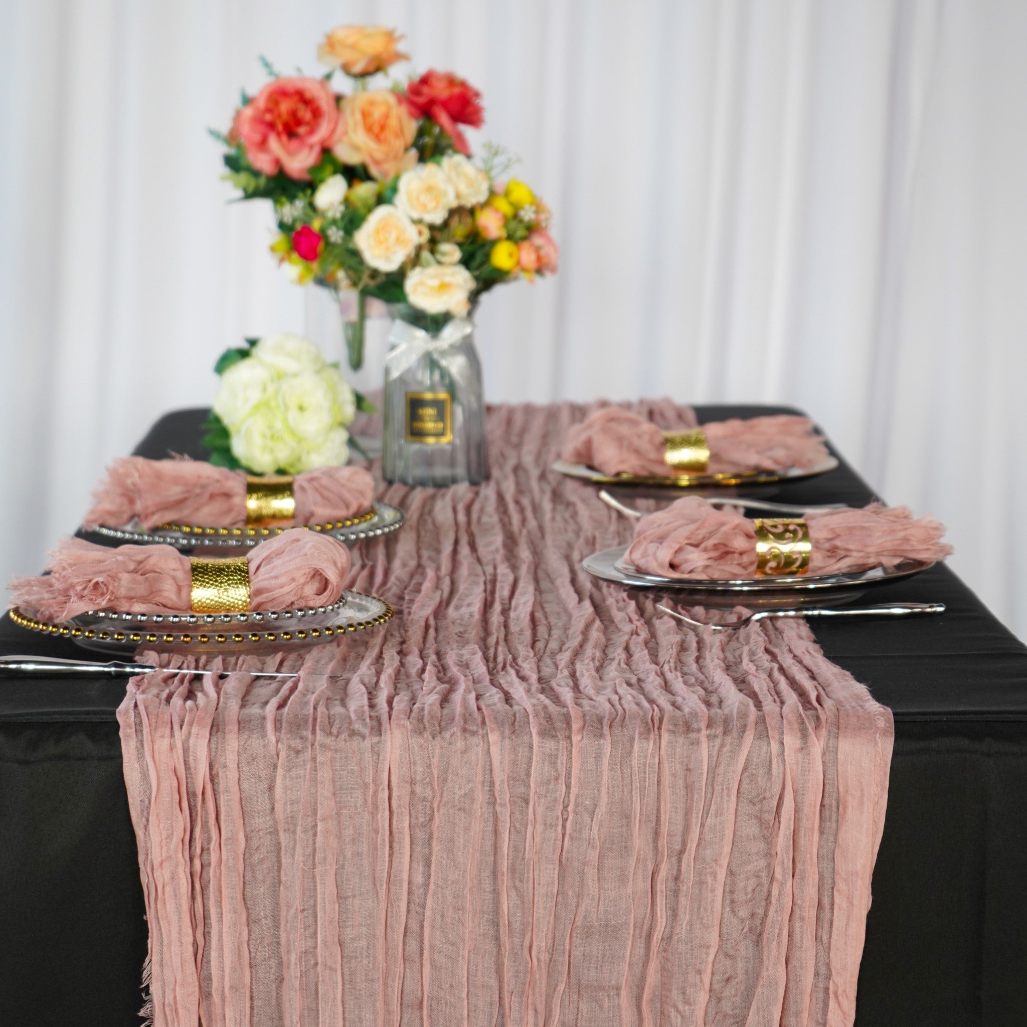 https://cdn.shopify.com/s/files/1/0042/0390/5136/products/premium-cheesecloth-table-runner-dusty-rose.jpg?v=1668461394