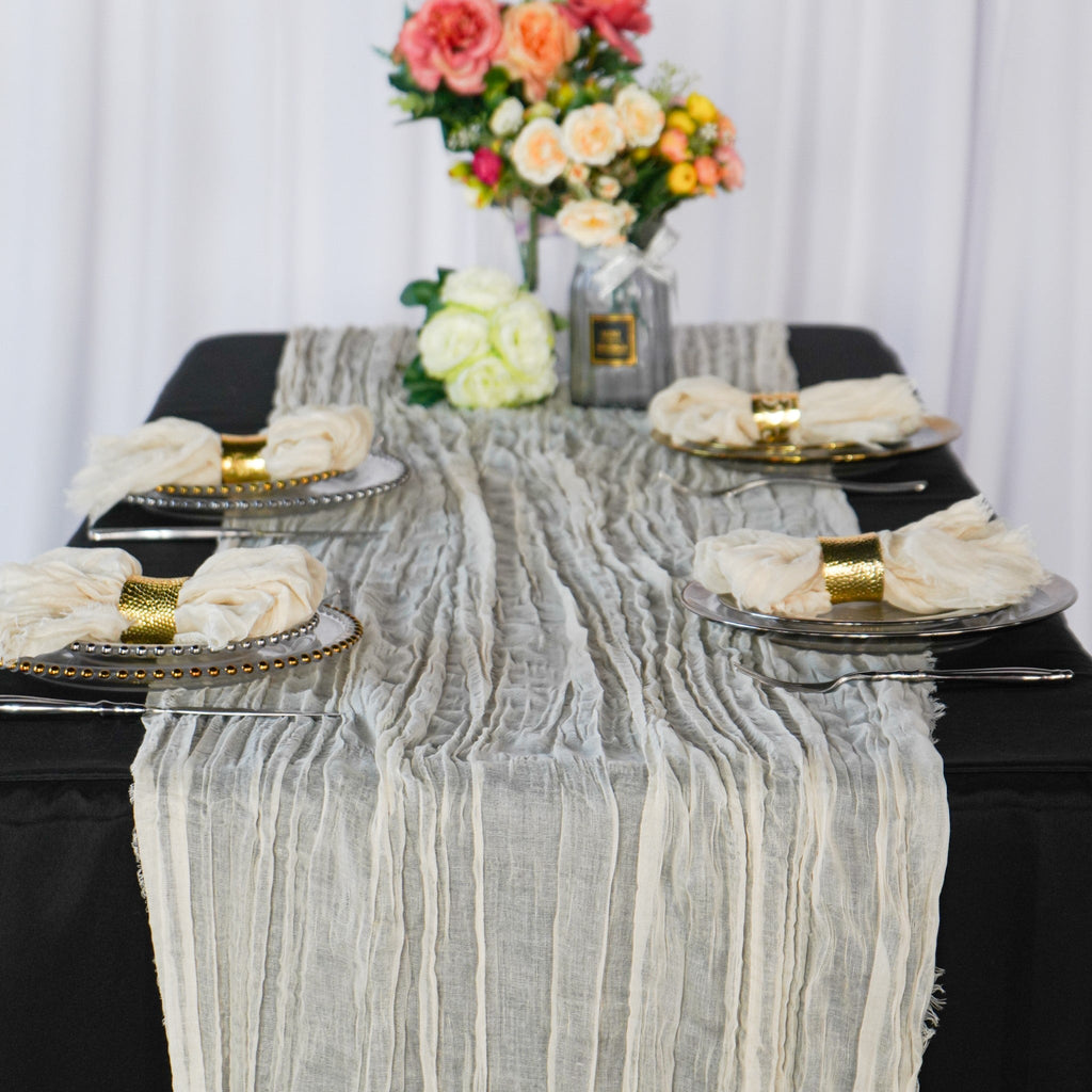 https://cdn.shopify.com/s/files/1/0042/0390/5136/products/premium-cheesecloth-table-runner-ivory.jpg?v=1747682877