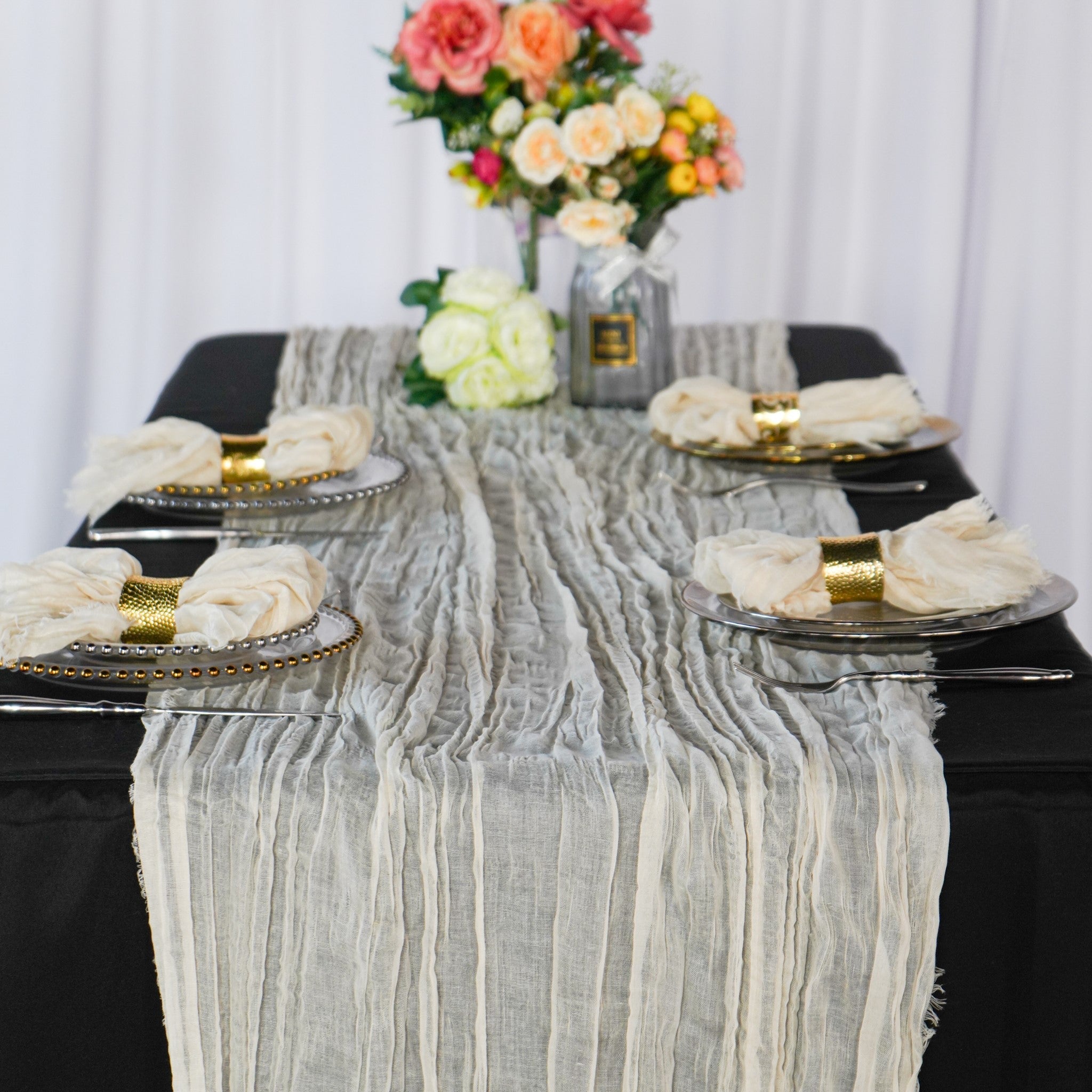 https://cdn.shopify.com/s/files/1/0042/0390/5136/products/premium-cheesecloth-table-runner-ivory.jpg?v=1747682877