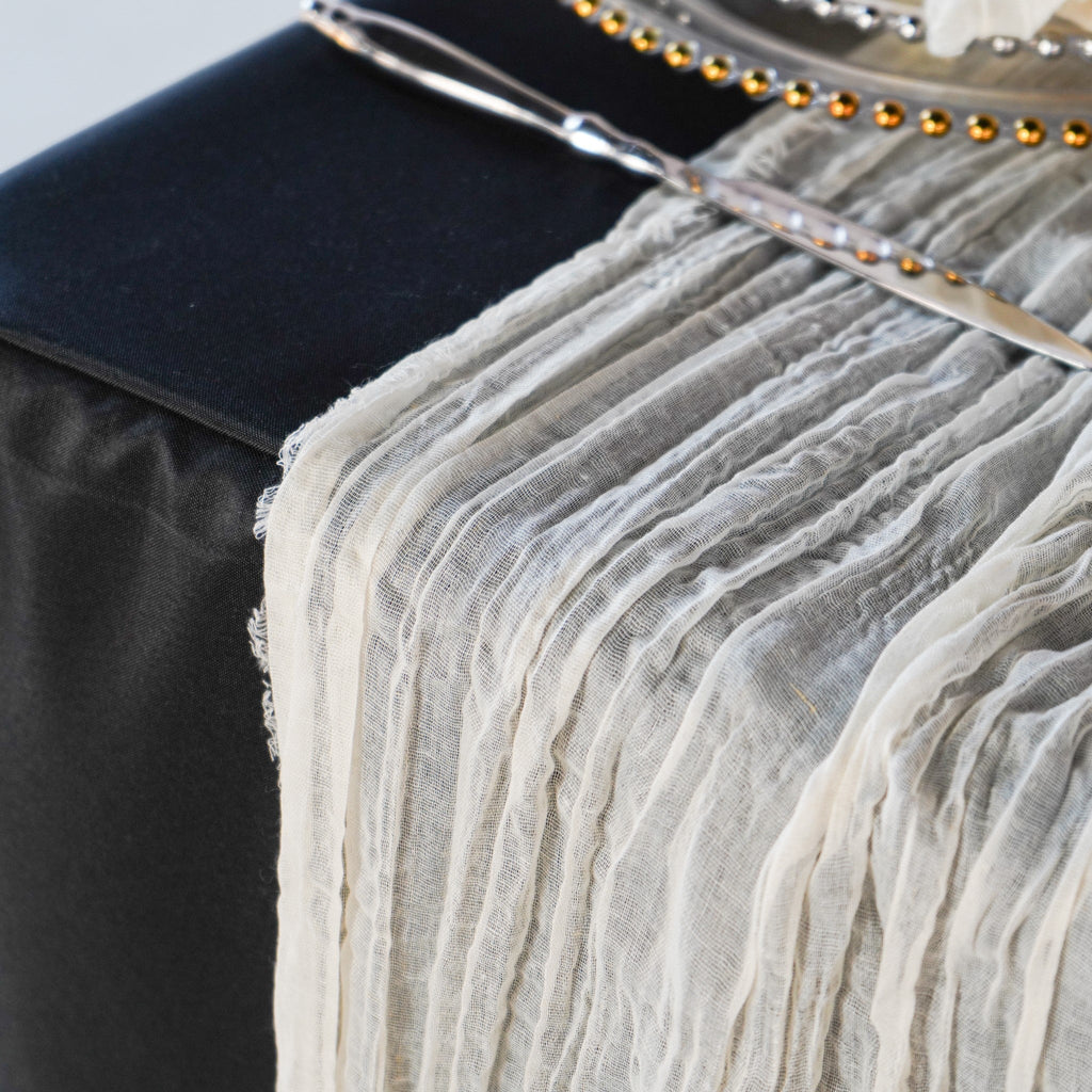 https://cdn.shopify.com/s/files/1/0042/0390/5136/products/premium-cheesecloth-table-runner-ivory1.jpg?v=1744688502