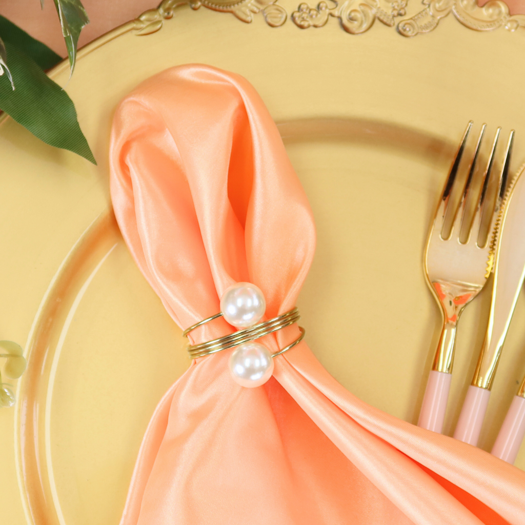 https://cdn.shopify.com/s/files/1/0042/0390/5136/files/spiral-faux-pearl-napkin-ring-gold1_18db4f3e-a351-4f34-a545-a8f5f164239e.png?v=1744286344